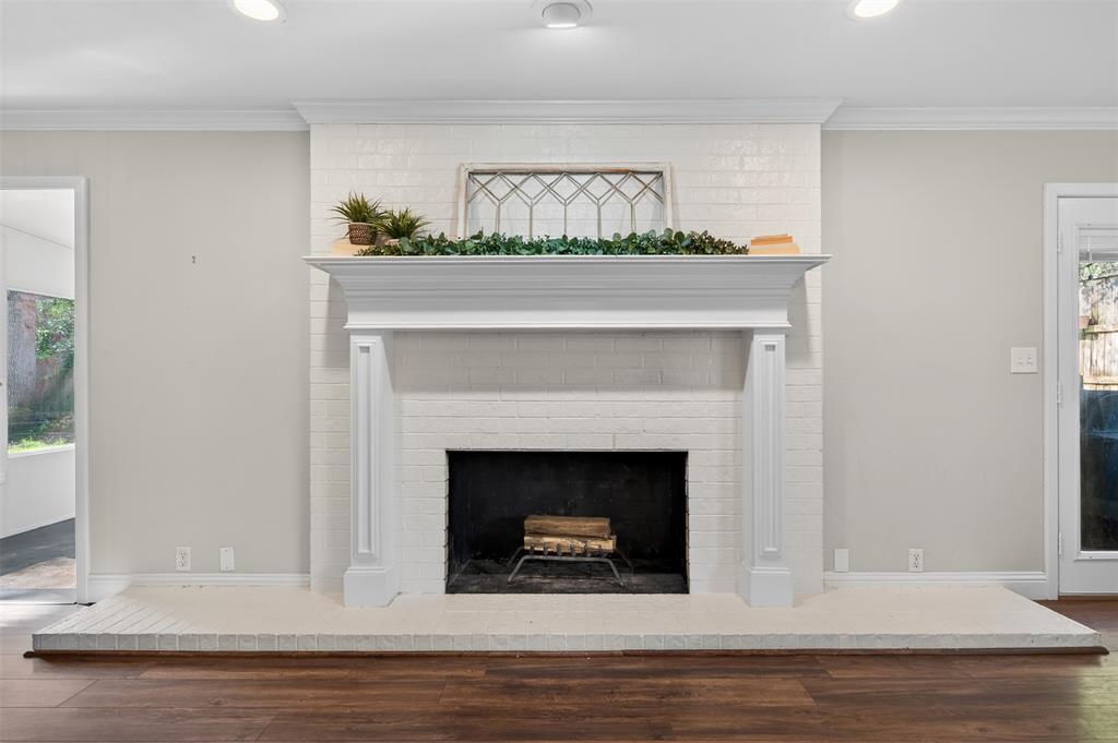 5008 Marble Falls Road Fort Worth, TX 76103 - Photo 6 of 33 a living room with a fireplace