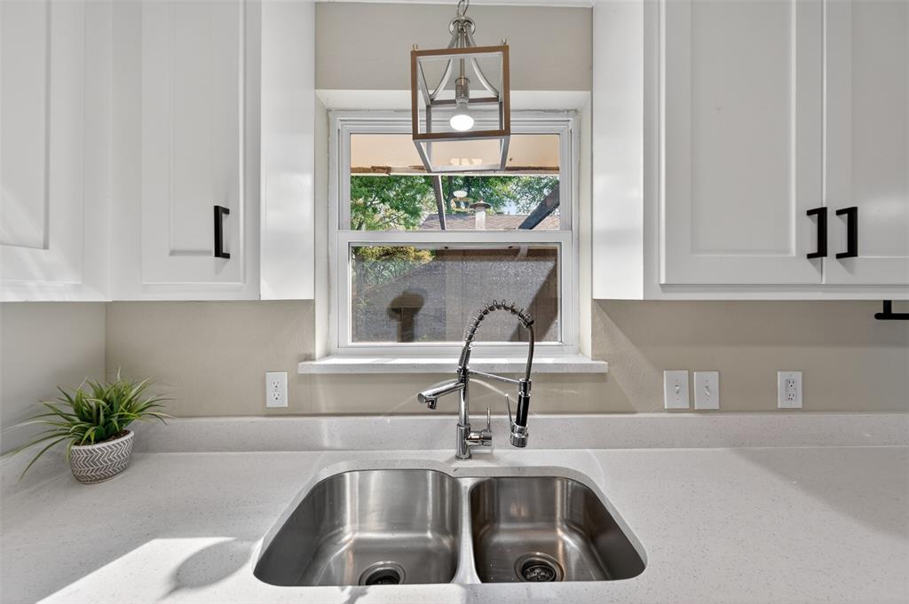 5008 Marble Falls Road Fort Worth, TX 76103 - Photo 9 of 33 a kitchen with a sink and a window