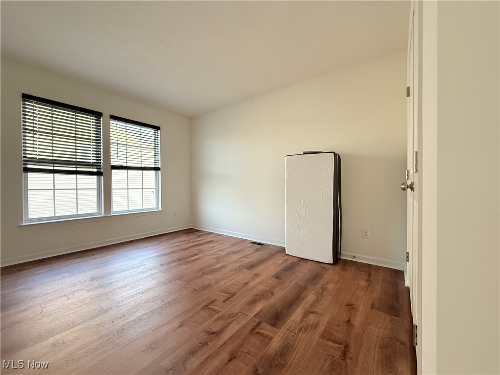 155 Stone Ridge Way Berea, OH 44017 - Photo 18 of 32 Empty room featuring wood finished floors and baseboards