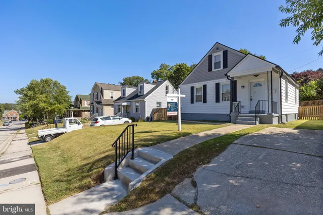 a view of a house with swimming pool and porch