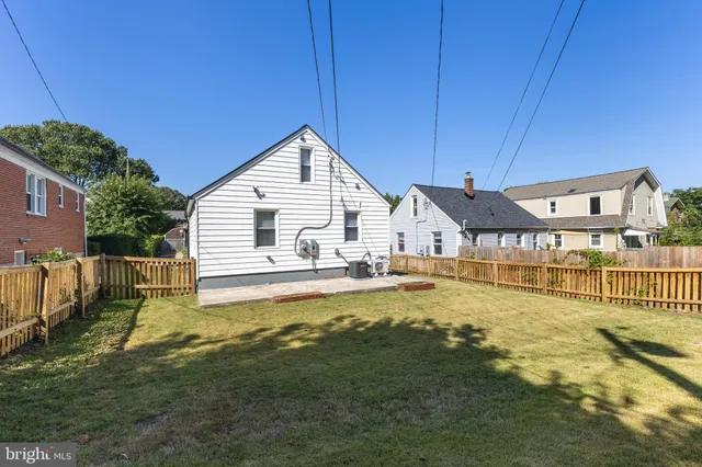 a view of a house with a yard patio and swimming pool