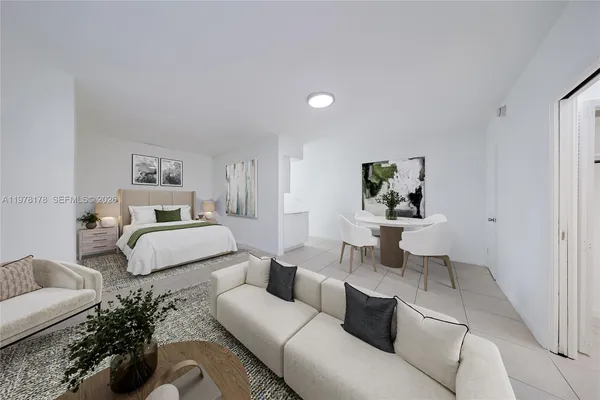 a bedroom with a bed and couch