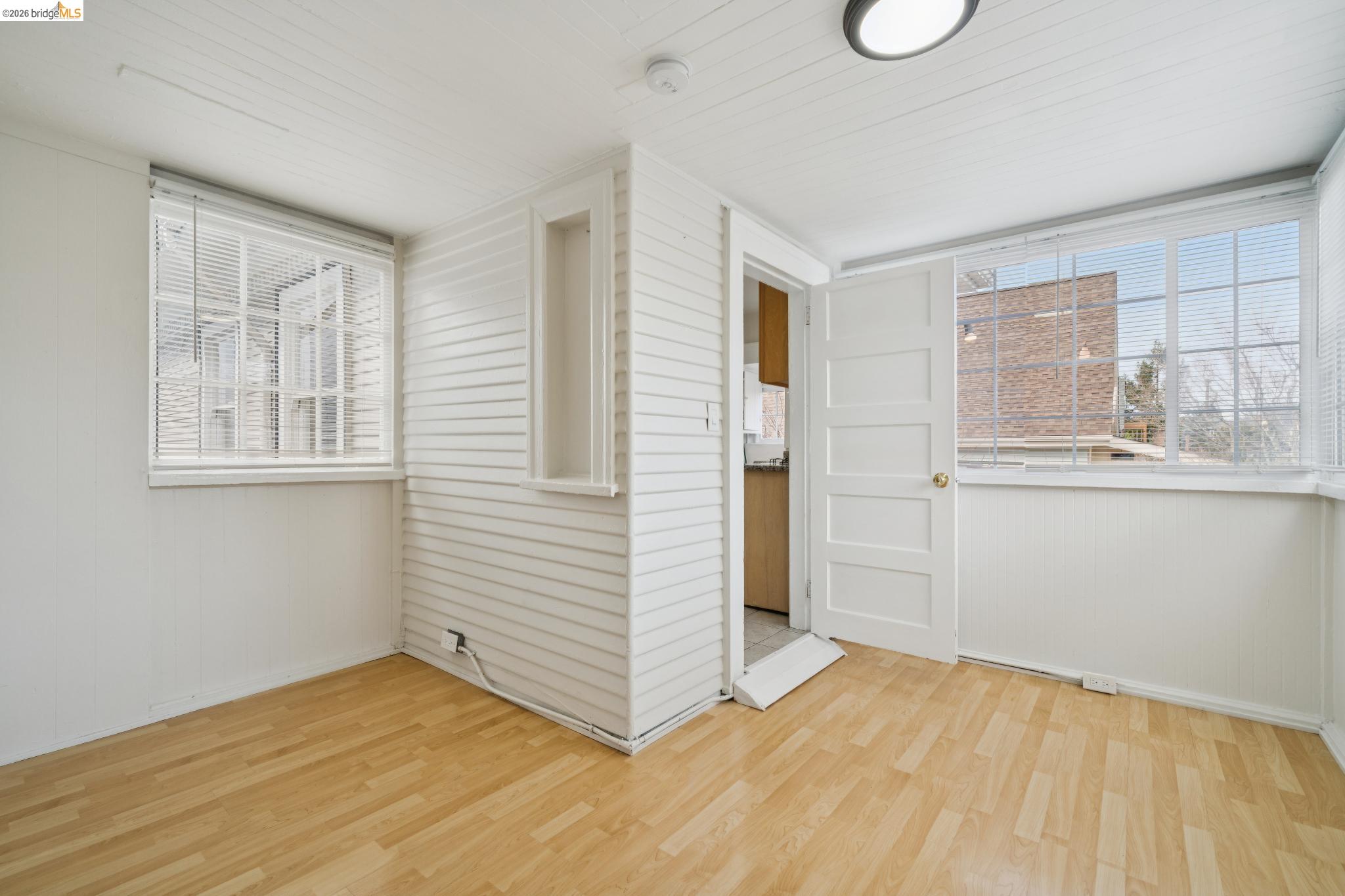 2923 Wheeler Street Berkeley, CA 94705 - Photo 19 of 28 Empty room featuring light wood-style floors and healthy amount of natural light