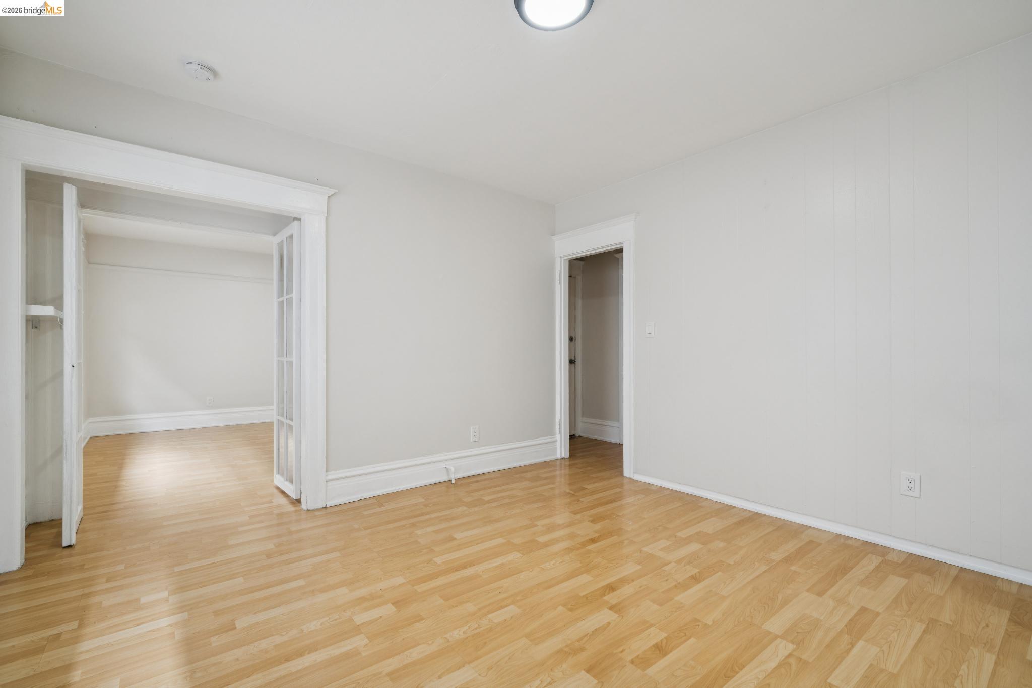 2923 Wheeler Street Berkeley, CA 94705 - Photo 22 of 28 Unfurnished bedroom with light wood-style floors and baseboards