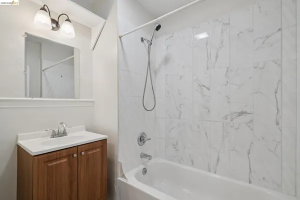 a bathroom with a glass shower door