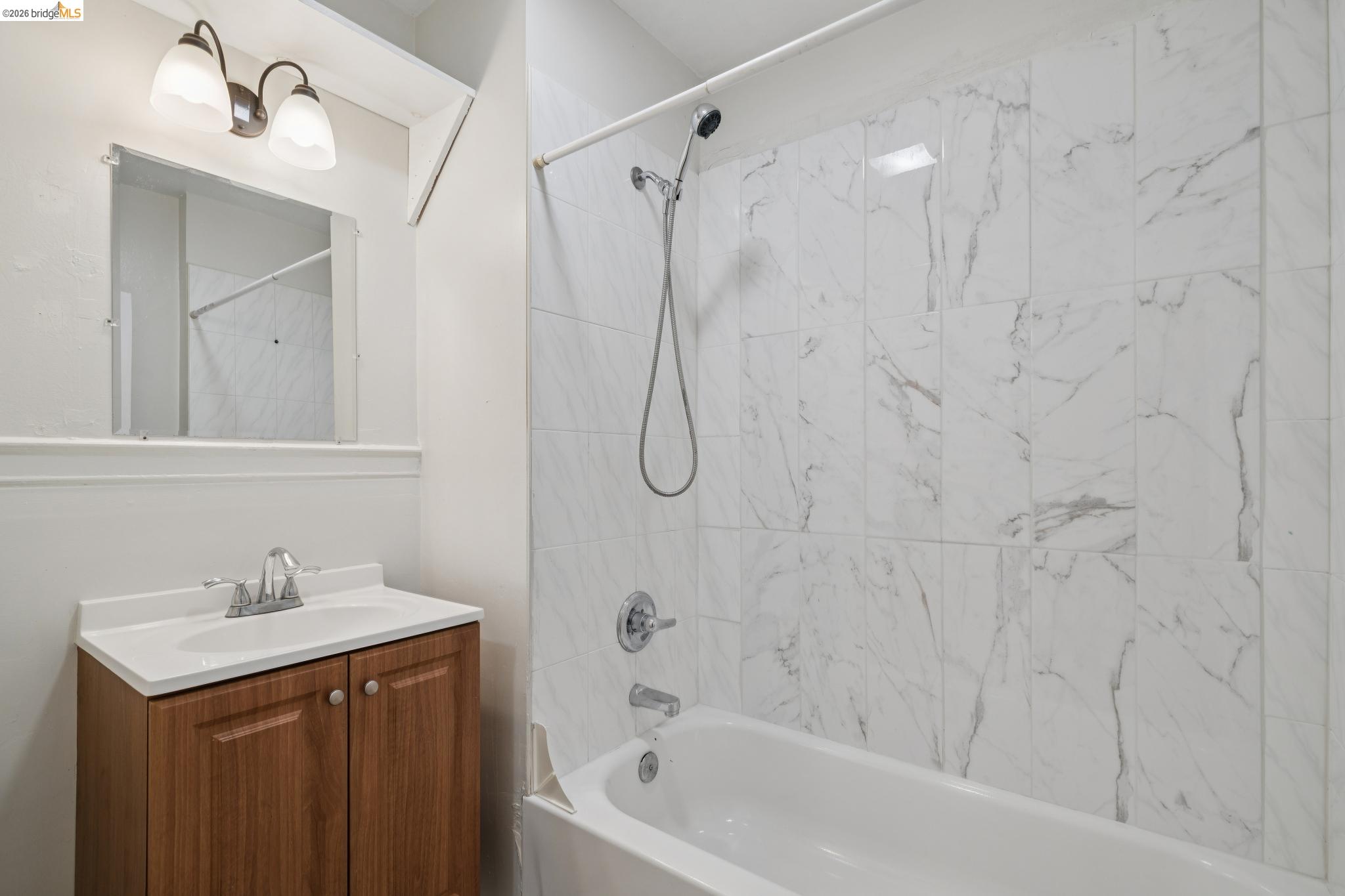 2923 Wheeler Street Berkeley, CA 94705 - Photo 24 of 28 Bathroom featuring vanity and bathing tub / shower combination