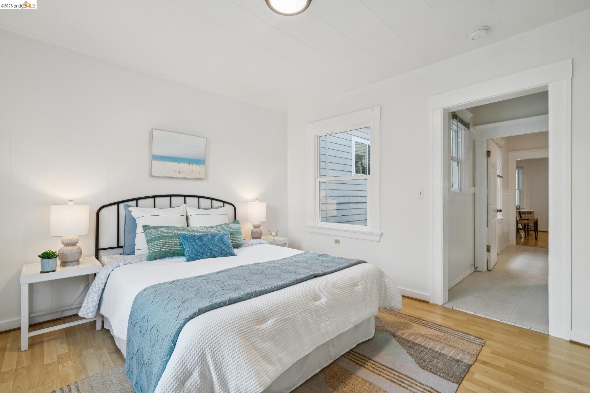 2923 Wheeler Street Berkeley, CA 94705 - Photo 10 of 28 Bedroom featuring light wood finished floors and baseboards