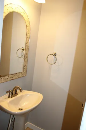 a bathroom with a sink and mirror