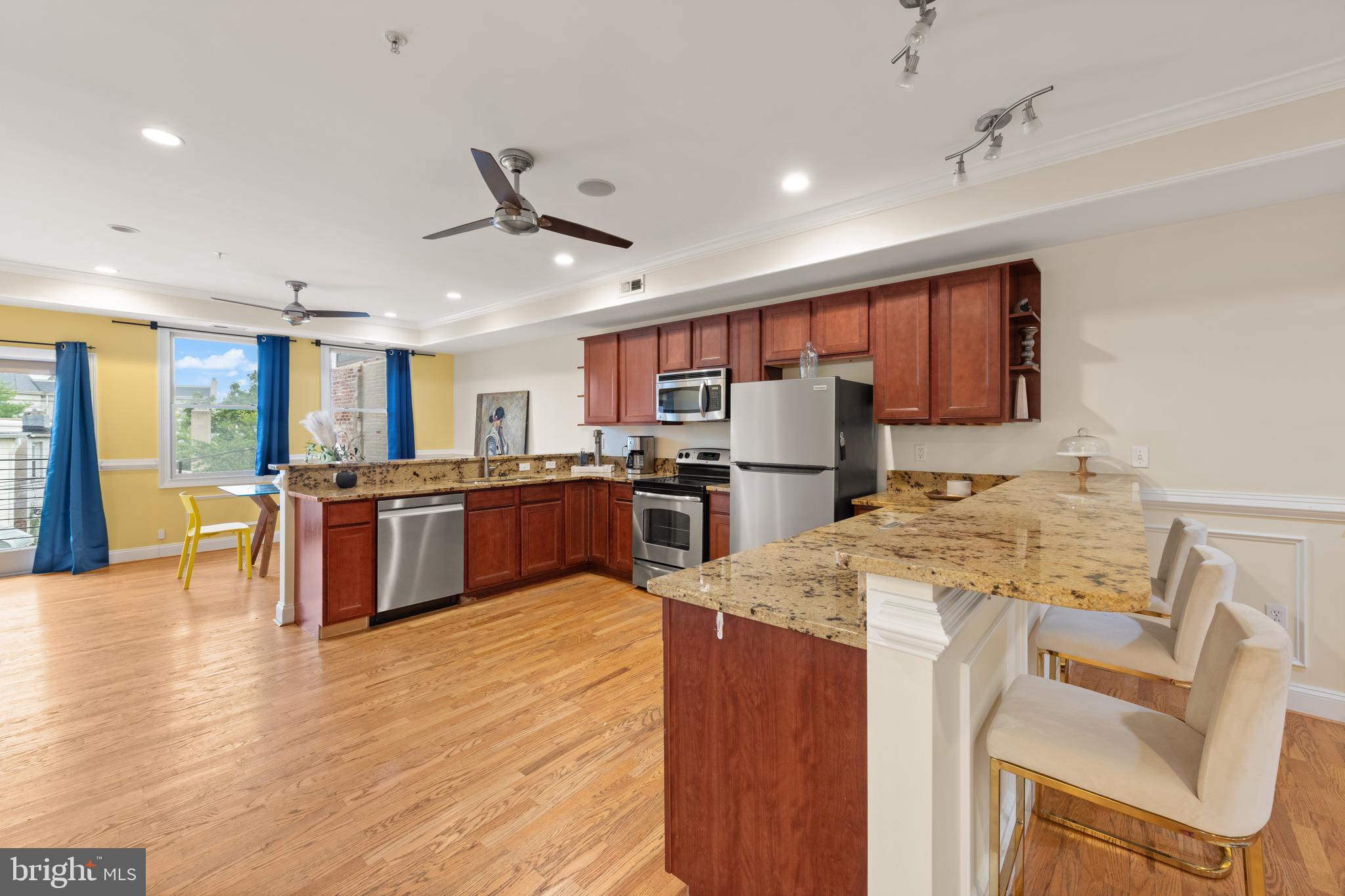 1645 New Jersey Avenue Northwest, Unit 2 Washington, DC 20001 - Photo 12 of 49 a kitchen with stainless steel appliances granite countertop a refrigerator a stove top oven a sink dishwasher and white cabinets with wooden floor