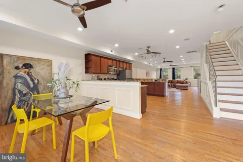 a view of kitchen dining table chairs and wooden floor