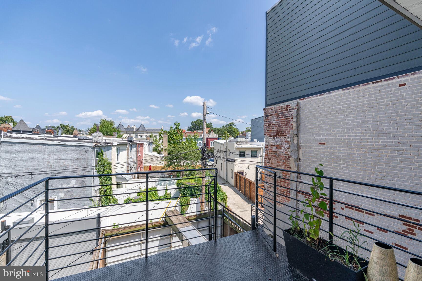 1645 New Jersey Avenue Northwest, Unit 2 Washington, DC 20001 - Photo 25 of 49 a city view from a balcony with outdoor seating