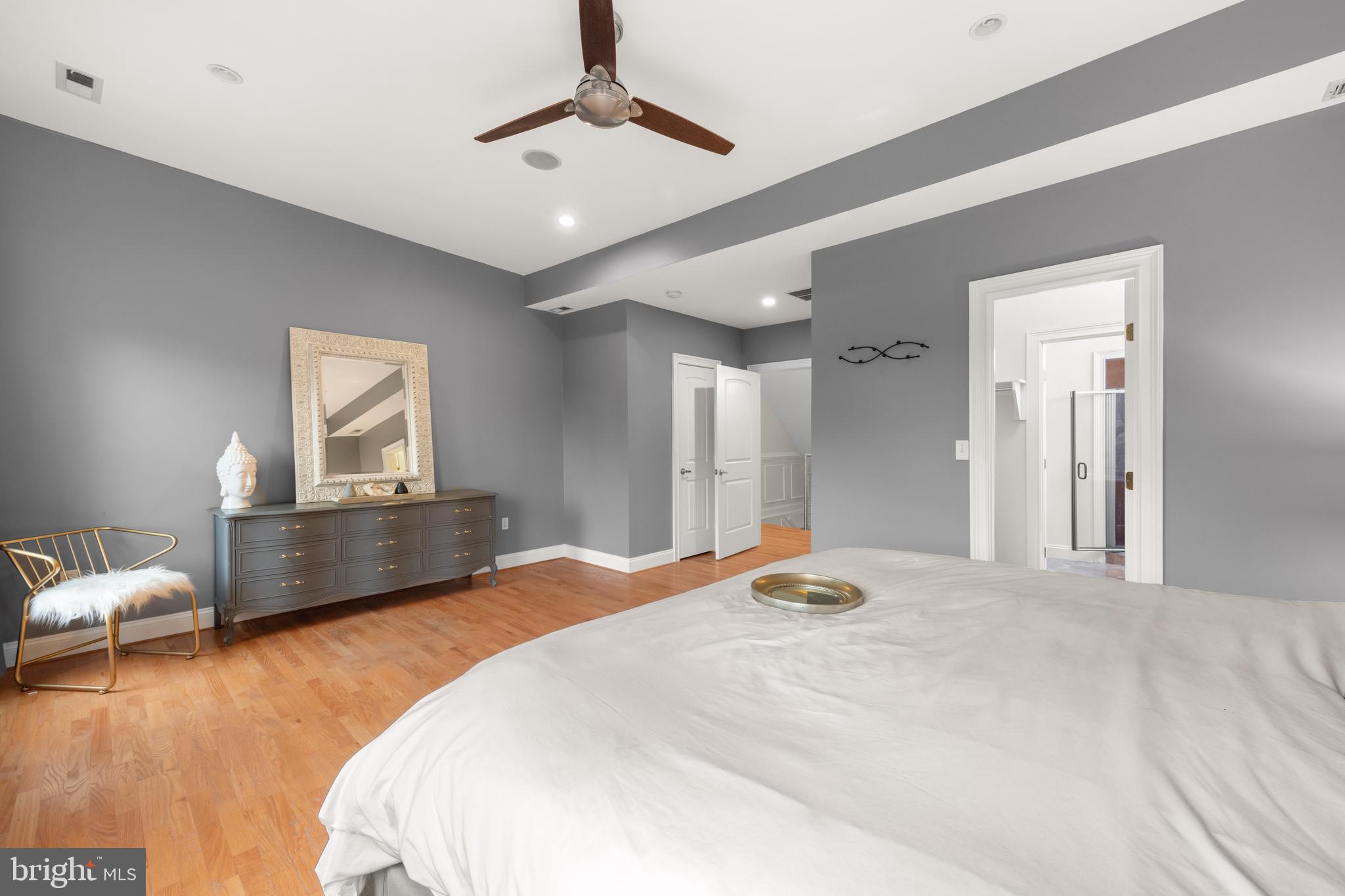 1645 New Jersey Avenue Northwest, Unit 2 Washington, DC 20001 - Photo 29 of 49 a bedroom with a bed and wooden floor