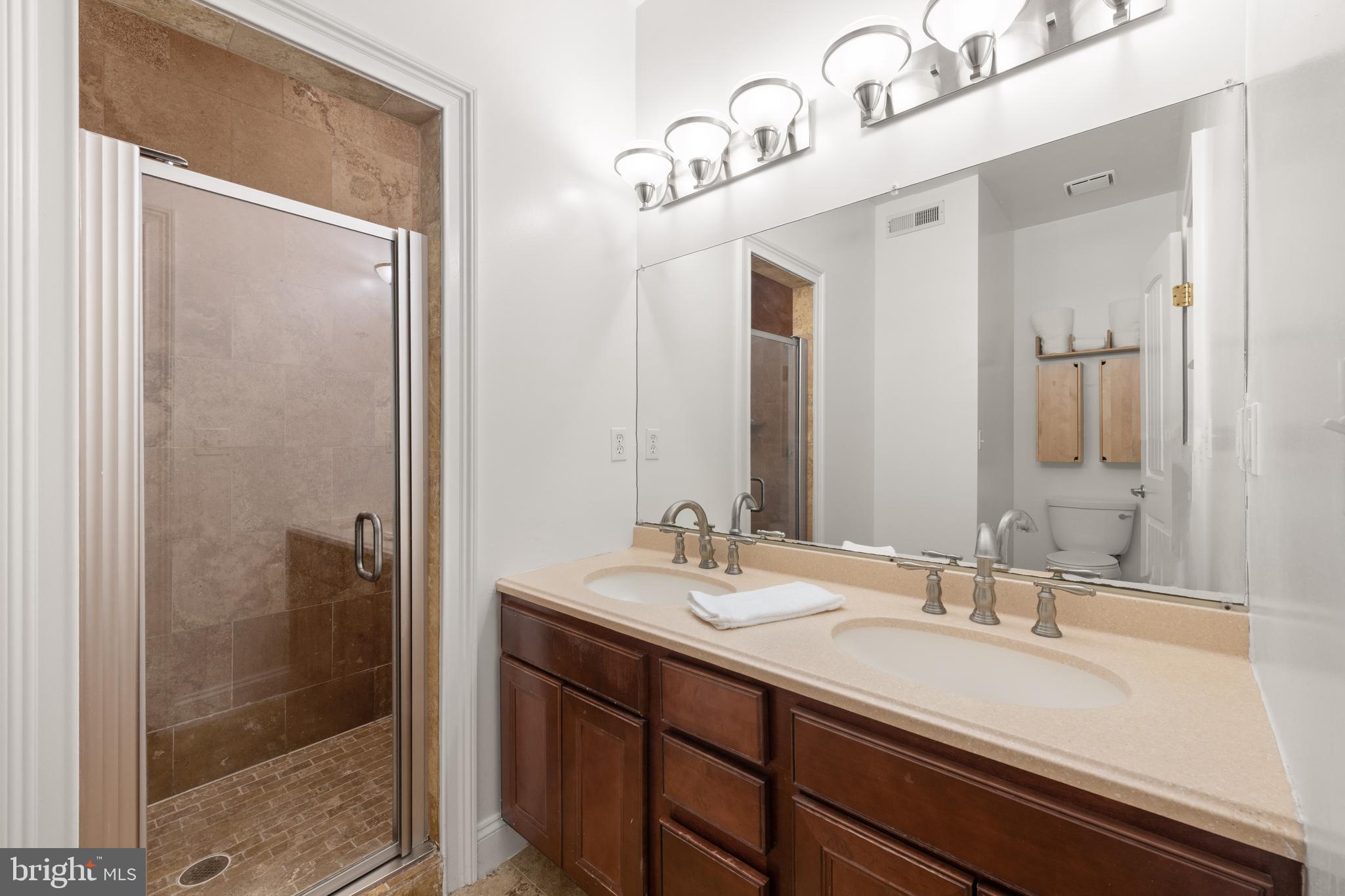 1645 New Jersey Avenue Northwest, Unit 2 Washington, DC 20001 - Photo 31 of 49 a bathroom with a sink and a mirror