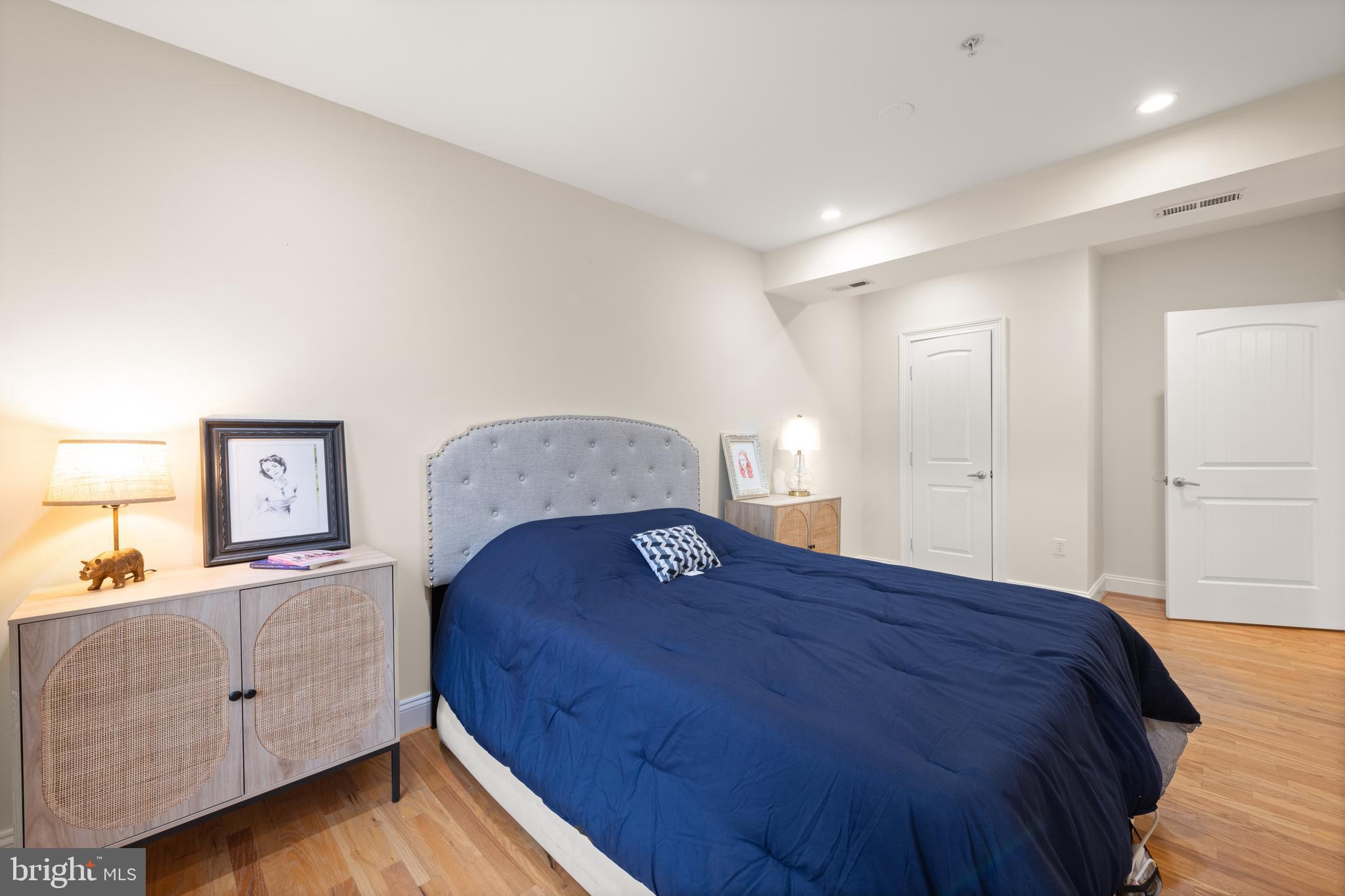 1645 New Jersey Avenue Northwest, Unit 2 Washington, DC 20001 - Photo 40 of 49 a bedroom with a bed and a dresser