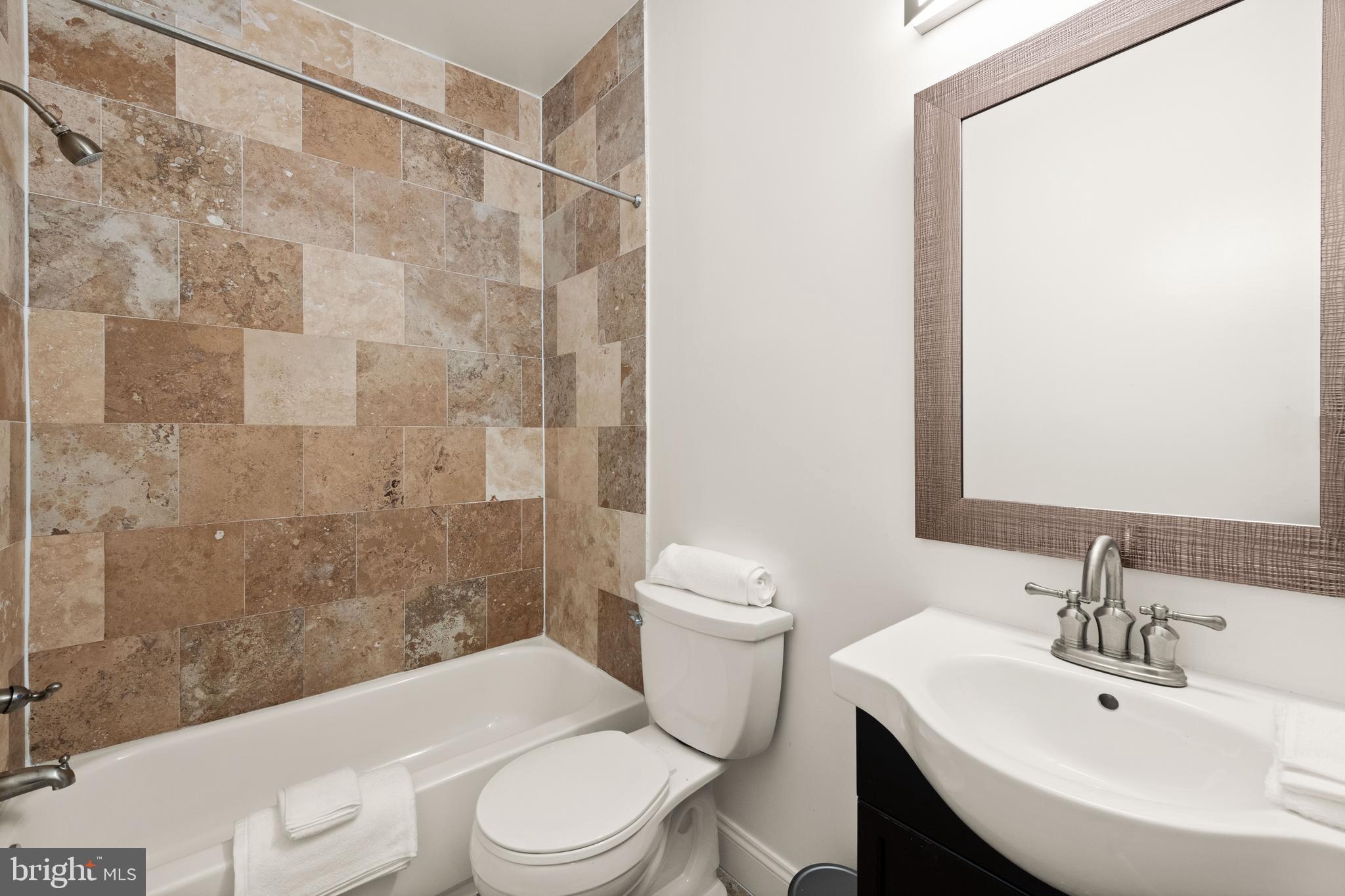 1645 New Jersey Avenue Northwest, Unit 2 Washington, DC 20001 - Photo 42 of 49 a bathroom with a sink toilet and shower