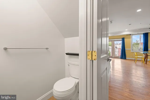 a bathroom with a toilet and a shower