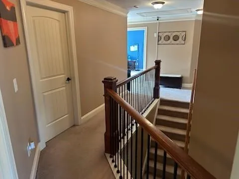 a view of entryway with wooden floor and stairs