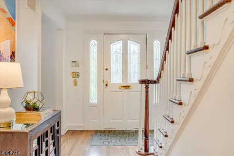 a view of entryway with wooden floor