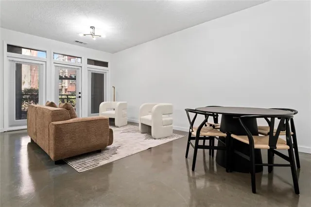 a living room with furniture and a table