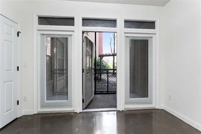 a view of a entryway with wooden floor