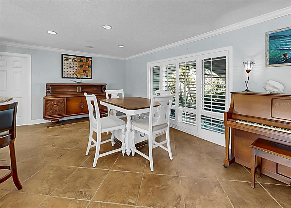 6317 Cocoa Lane Apollo Beach, FL 33572 - Photo 16 of 63 a dining room with furniture and a window