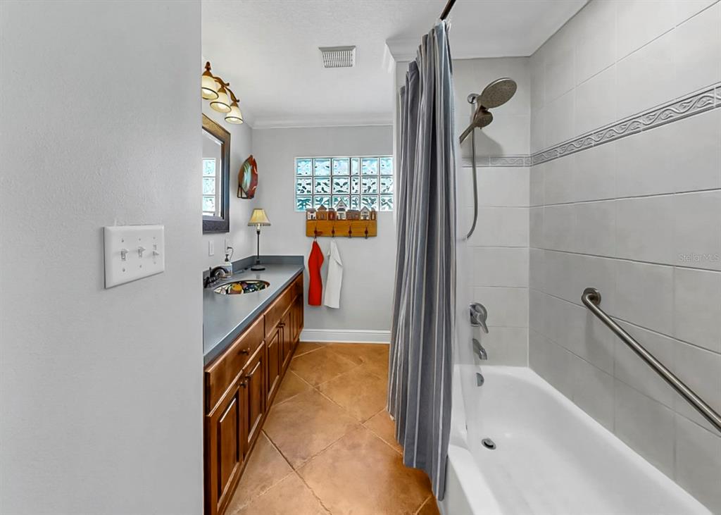 6317 Cocoa Lane Apollo Beach, FL 33572 - Photo 40 of 63 a bathroom with a bathtub and a shower