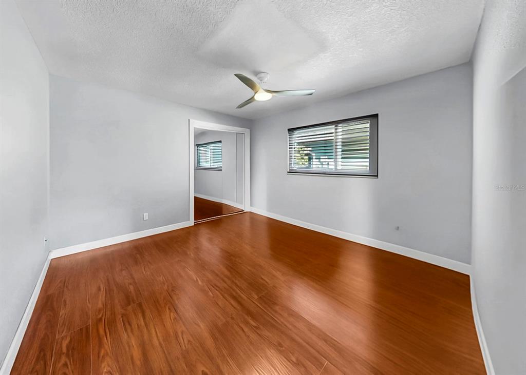 6317 Cocoa Lane Apollo Beach, FL 33572 - Photo 41 of 63 a view of empty room with wooden floor