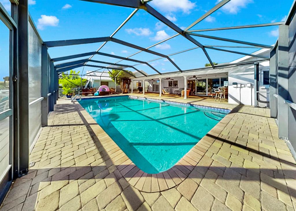 6317 Cocoa Lane Apollo Beach, FL 33572 - Photo 46 of 63 a view of a swimming pool with a yard