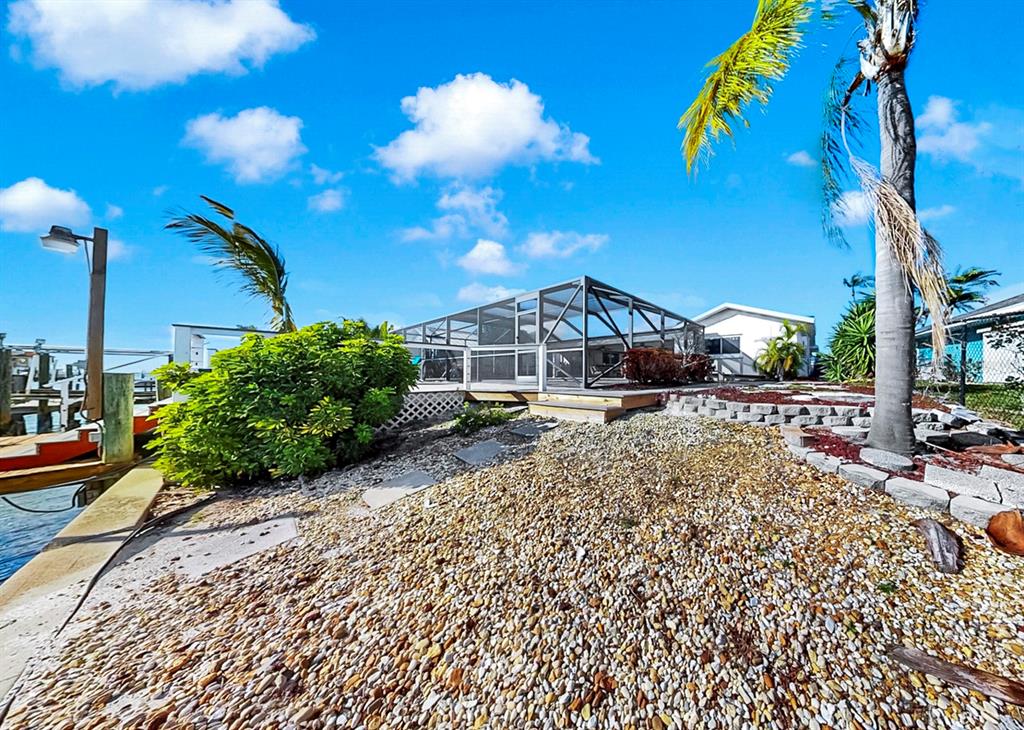 6317 Cocoa Lane Apollo Beach, FL 33572 - Photo 47 of 63 a front view of a house with a yard