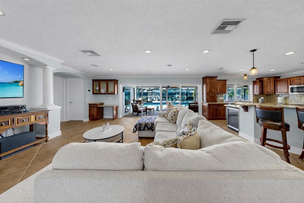 6317 Cocoa Lane Apollo Beach, FL 33572 - Photo 8 of 63 a living room with furniture and a flat screen tv