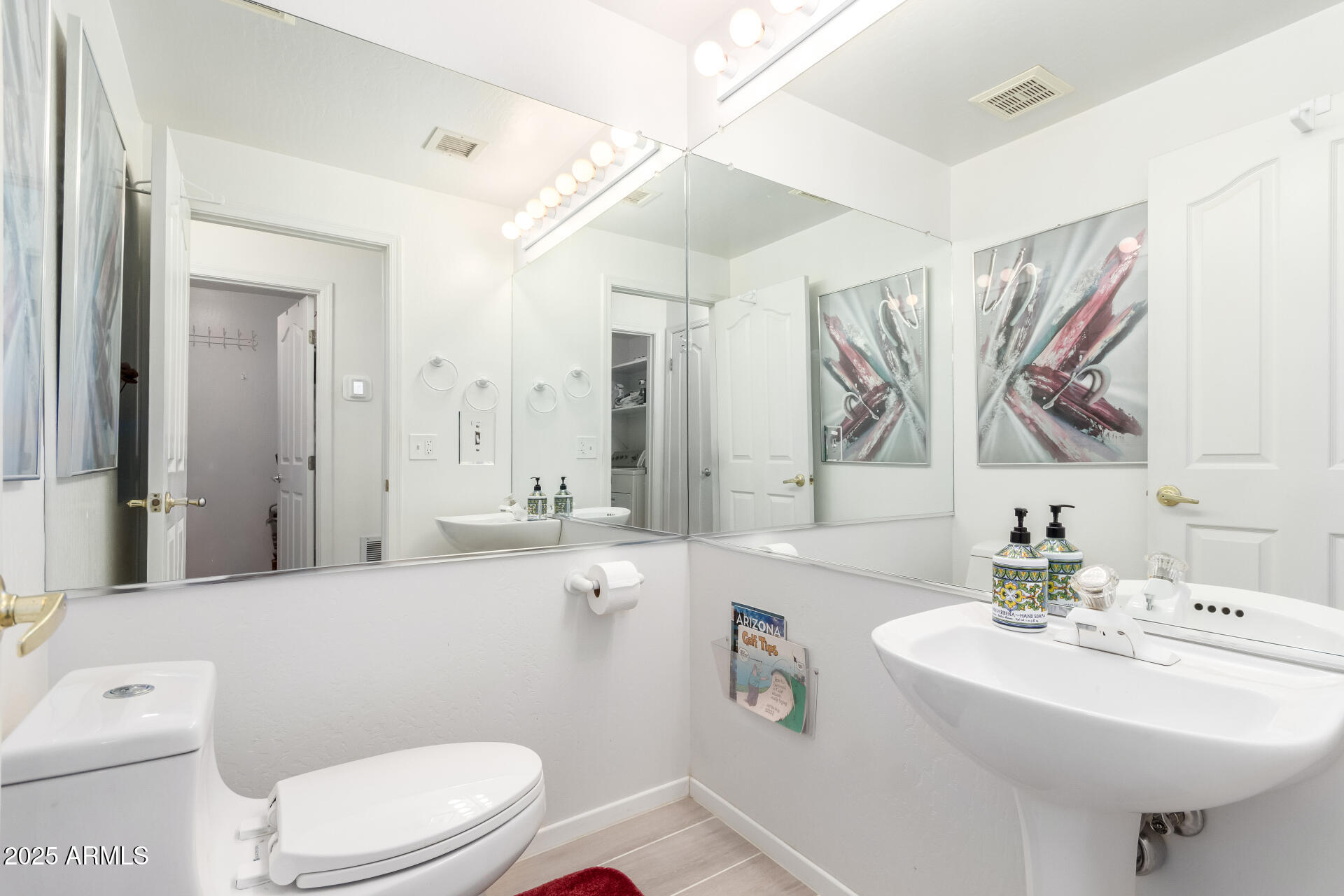 5445 East McKellips Road, Unit 28 Mesa, AZ 85215 - Photo 13 of 39 a bathroom with a sink a toilet and mirror