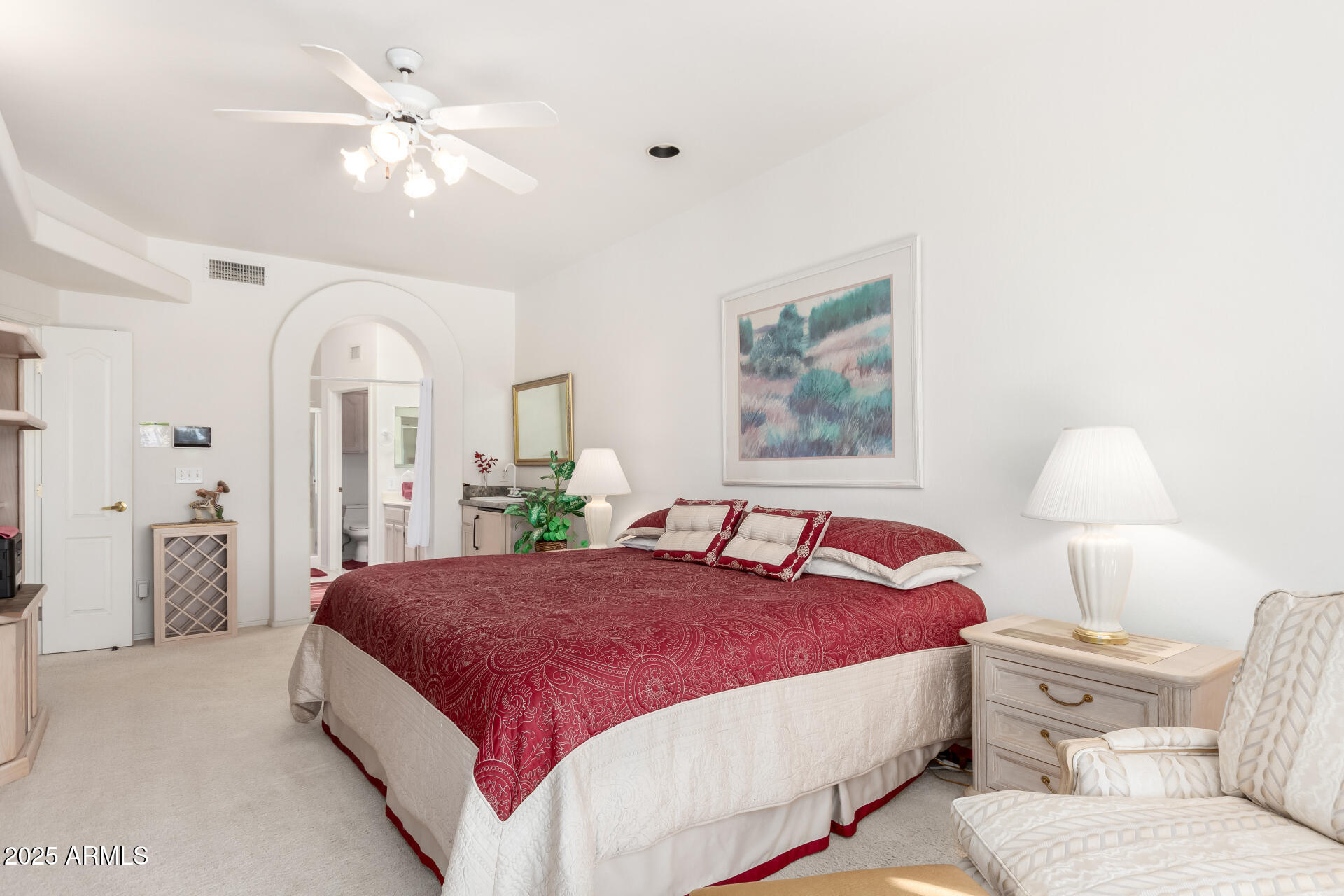 5445 East McKellips Road, Unit 28 Mesa, AZ 85215 - Photo 16 of 39 a spacious bedroom with a bed and a chandelier