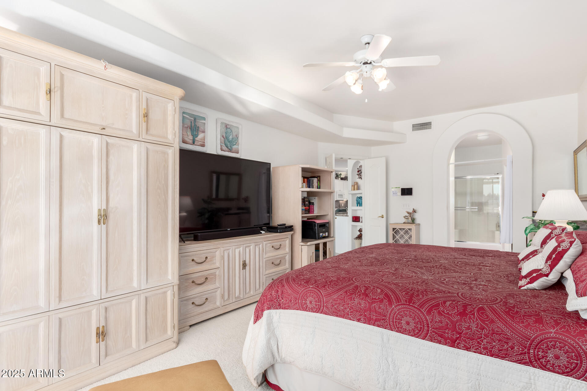 5445 East McKellips Road, Unit 28 Mesa, AZ 85215 - Photo 17 of 39 a spacious bedroom with a bed a flat screen tv and a dresser