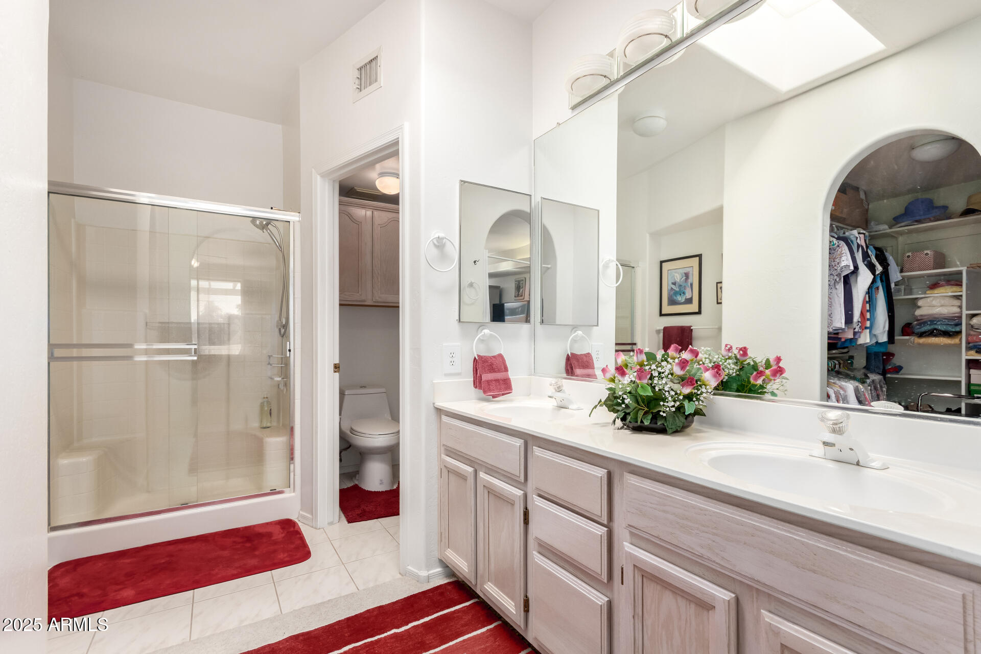 5445 East McKellips Road, Unit 28 Mesa, AZ 85215 - Photo 18 of 39 a bathroom with a sink double vanity and a shower