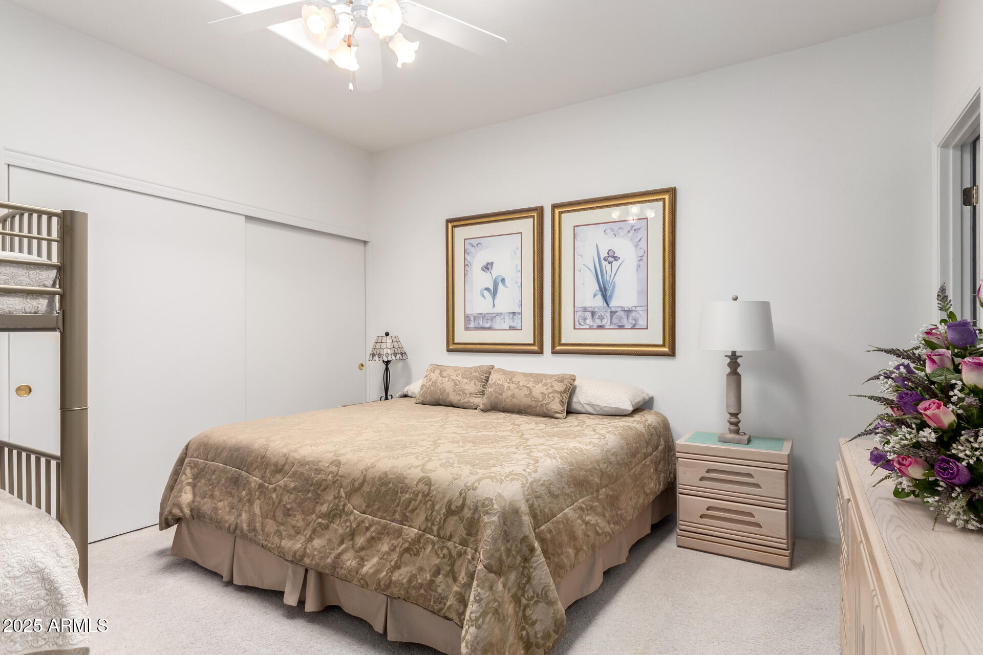 5445 East McKellips Road, Unit 28 Mesa, AZ 85215 - Photo 19 of 39 a bedroom with a bed and a chandelier