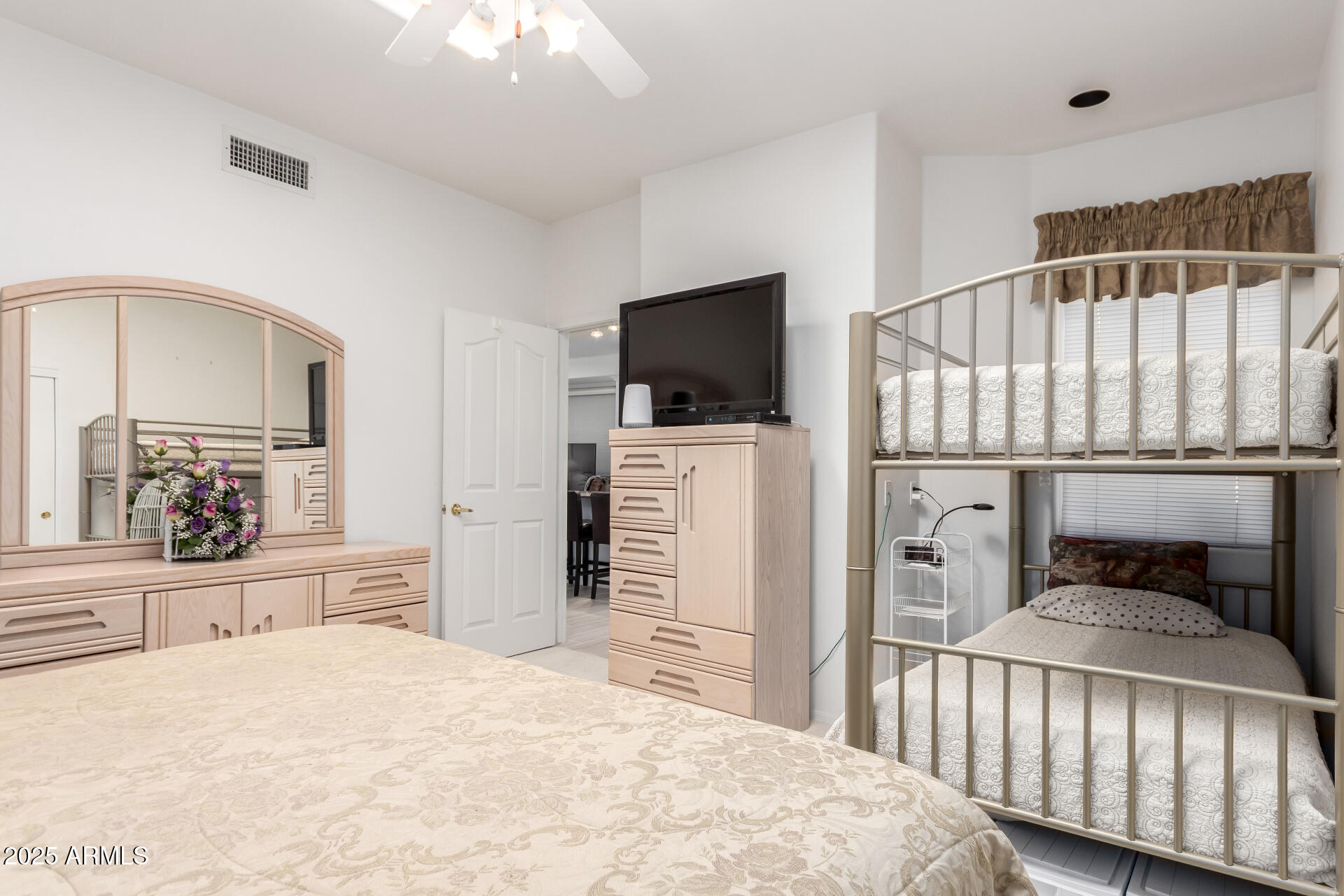 5445 East McKellips Road, Unit 28 Mesa, AZ 85215 - Photo 20 of 39 a bedroom with furniture and a flat screen tv