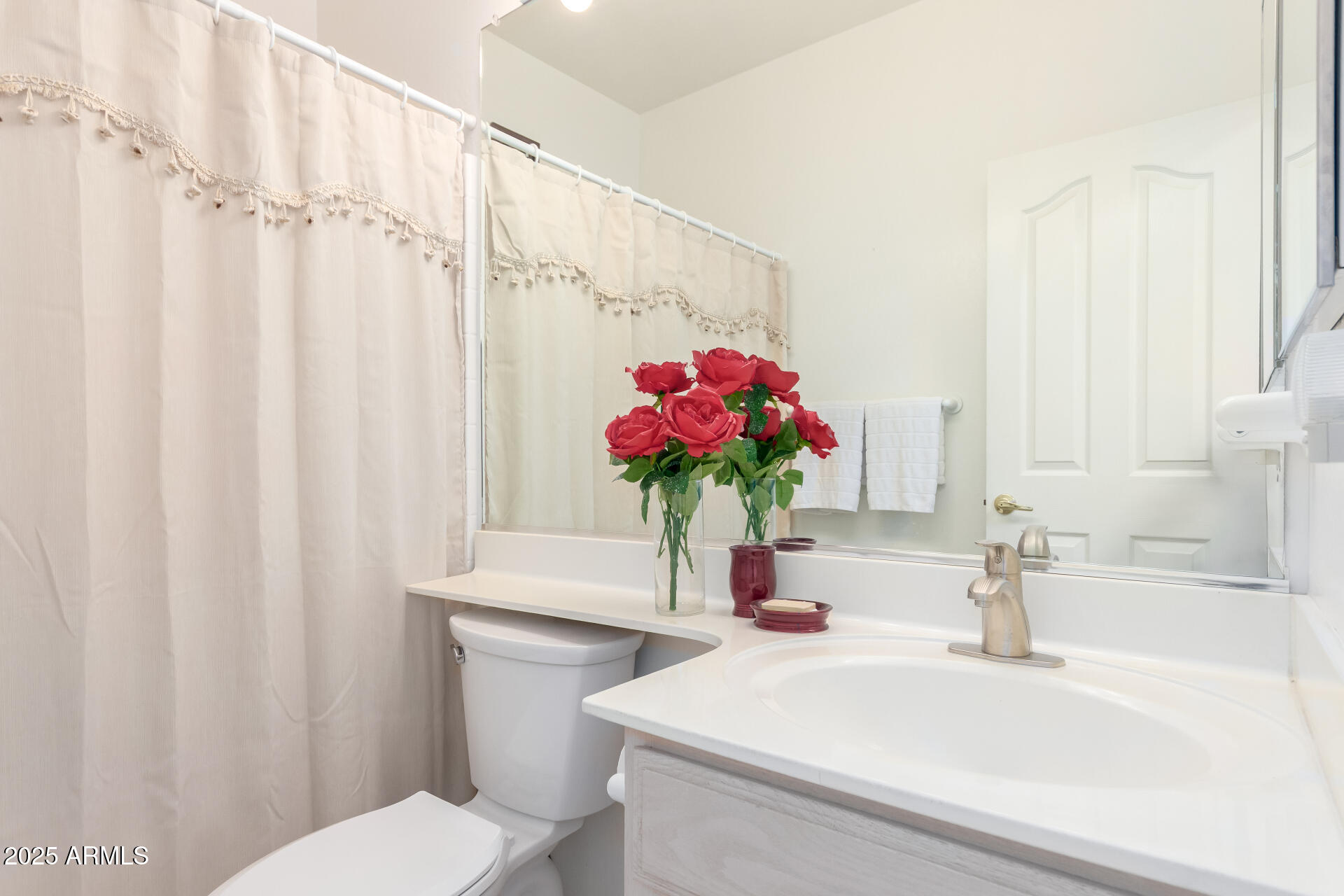 5445 East McKellips Road, Unit 28 Mesa, AZ 85215 - Photo 21 of 39 a bathroom with a sink a toilet and a mirror