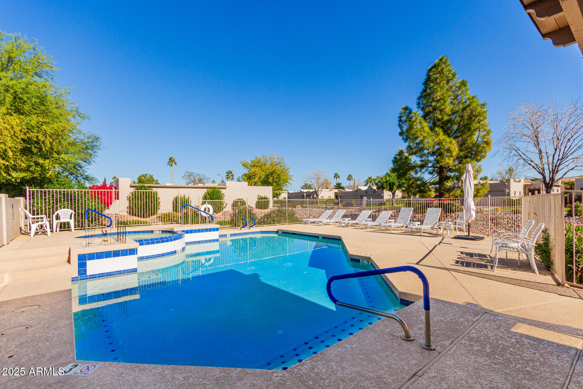 5445 East McKellips Road, Unit 28 Mesa, AZ 85215 - Photo 27 of 39 a swimming pool with outdoor seating and yard