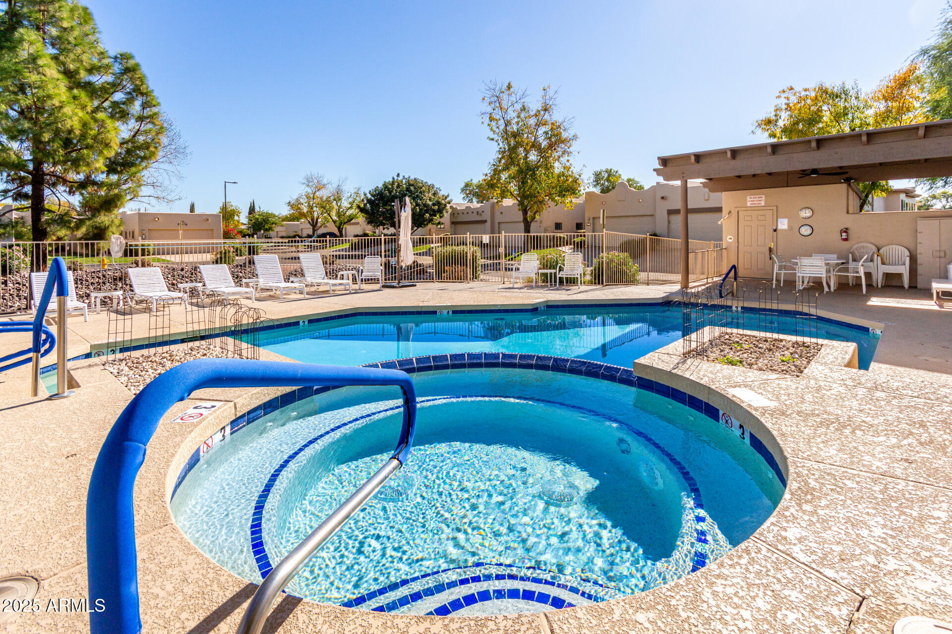 5445 East McKellips Road, Unit 28 Mesa, AZ 85215 - Photo 30 of 39 a swimming pool with outdoor seating and yard