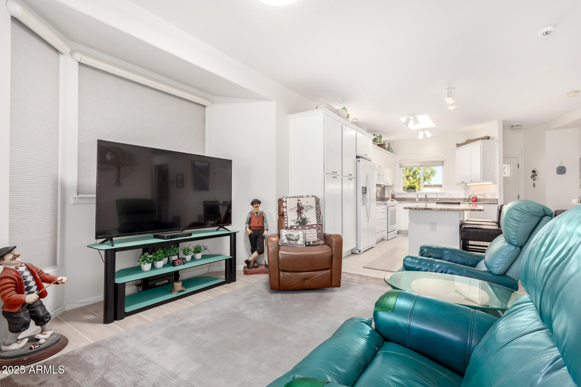 5445 East McKellips Road, Unit 28 Mesa, AZ 85215 - Photo 5 of 39 a living room with furniture and a flat screen tv
