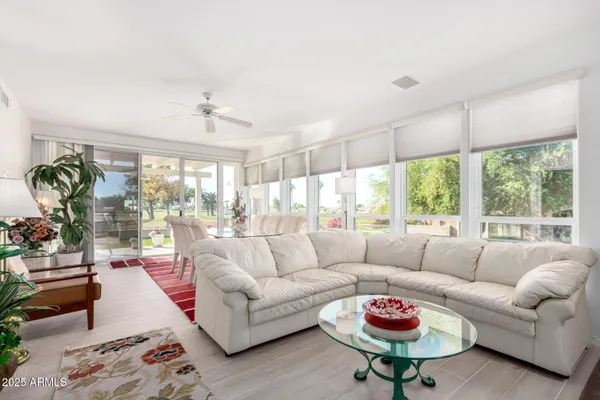 a living room with furniture and a table