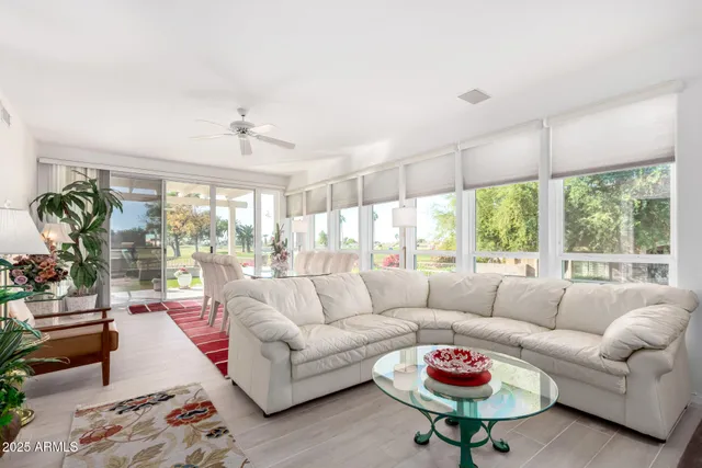 a living room with furniture and a table