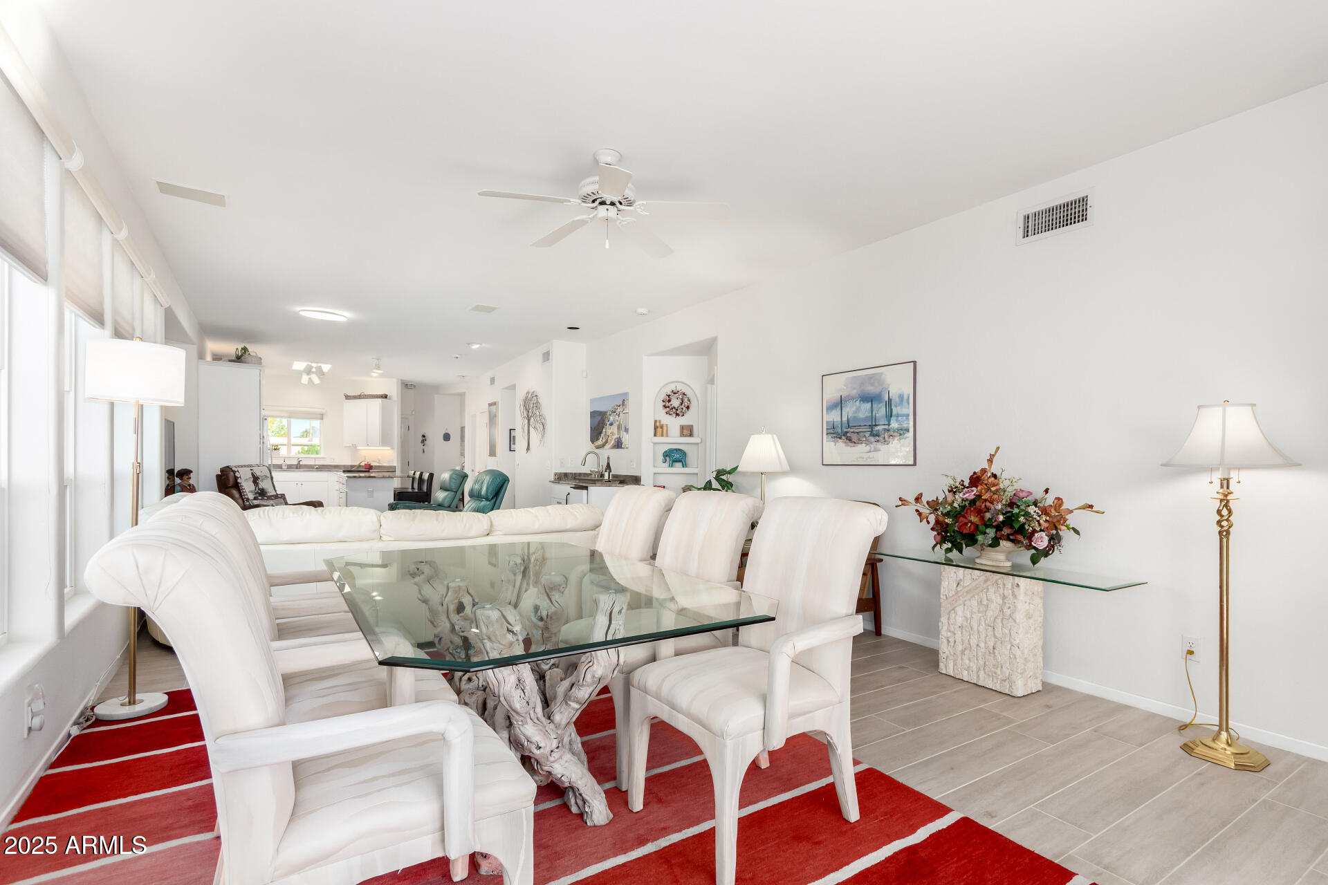 5445 East McKellips Road, Unit 28 Mesa, AZ 85215 - Photo 8 of 39 a view of a dining room with furniture and a chandelier