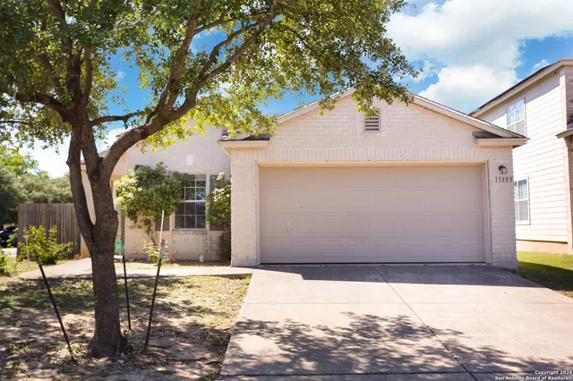 a view of a backyard of the house