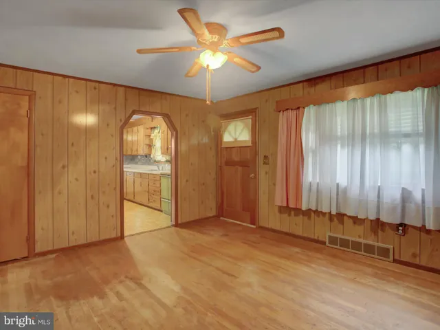 a kitchen with kitchen island a sink stove and cabinets