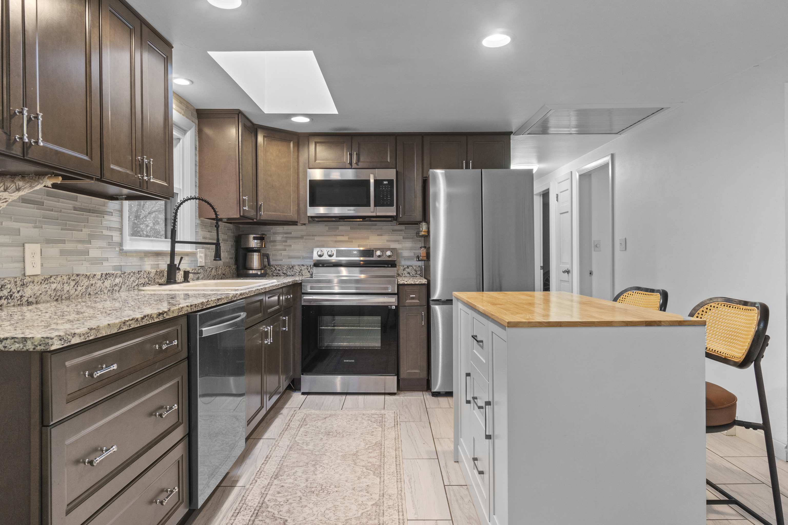 10 Green Acres Lane Thompson, CT 06255 - Photo 11 of 40 a kitchen with stainless steel appliances granite countertop a refrigerator stove microwave and sink