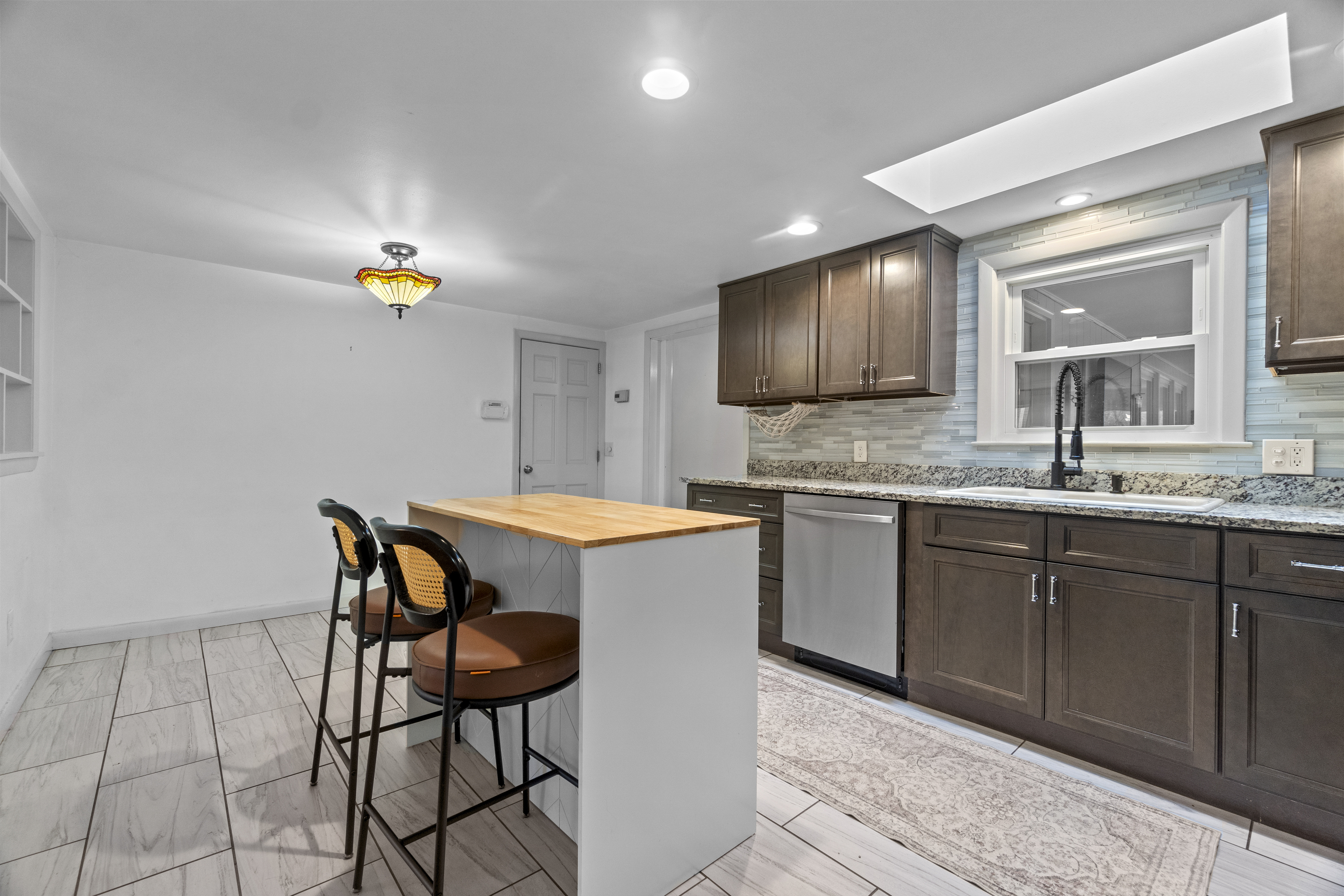10 Green Acres Lane Thompson, CT 06255 - Photo 12 of 40 a kitchen with a sink cabinets and window