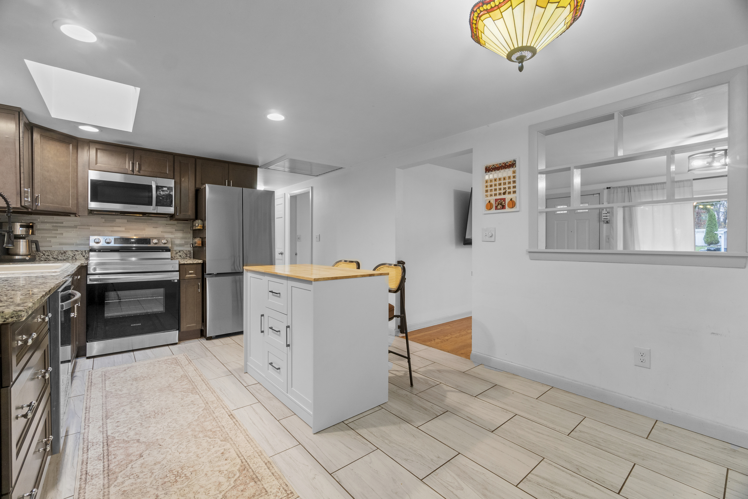 10 Green Acres Lane Thompson, CT 06255 - Photo 16 of 40 a kitchen with stainless steel appliances a refrigerator and a stove top oven