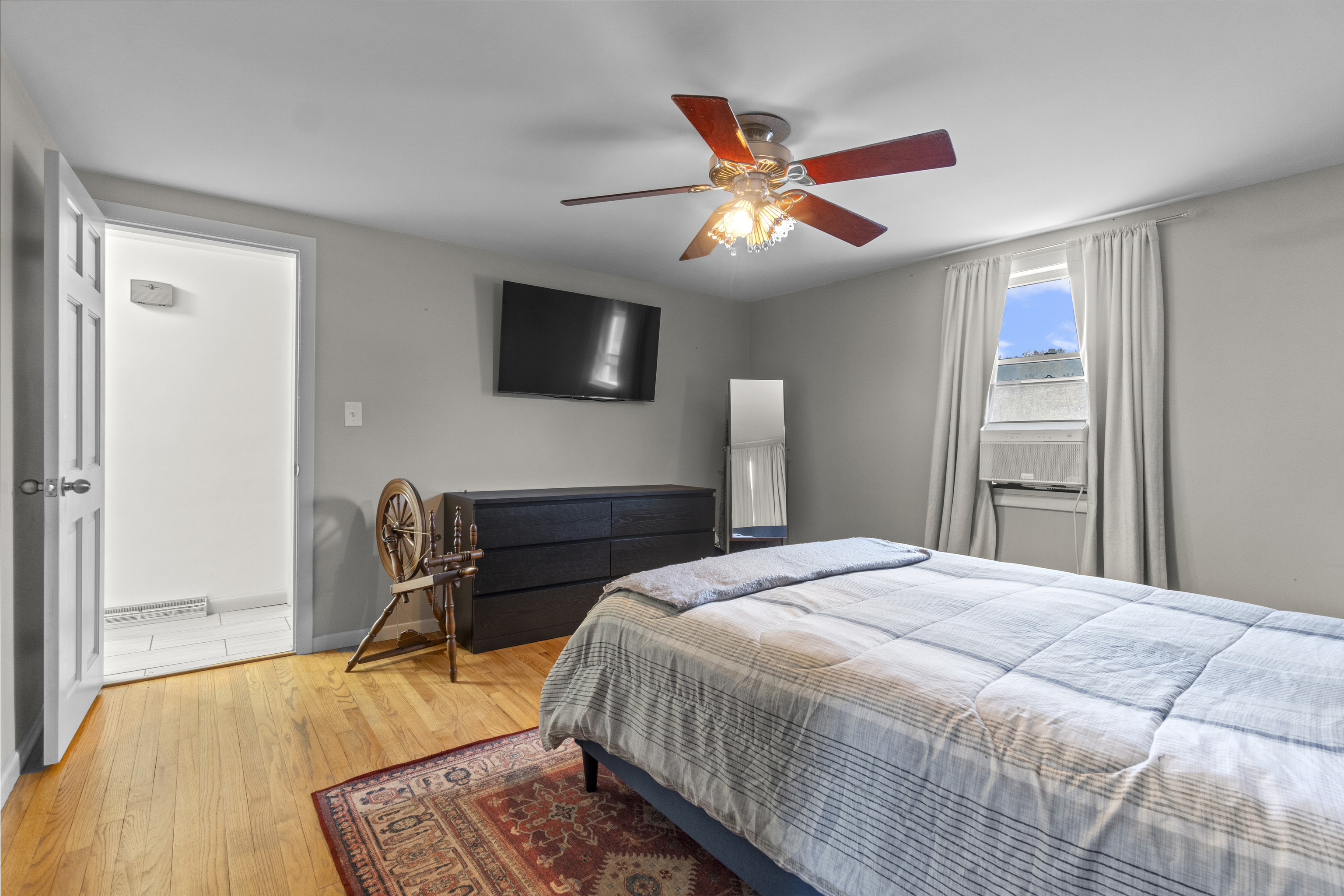 10 Green Acres Lane Thompson, CT 06255 - Photo 18 of 40 a bedroom with a bed and a flat screen tv