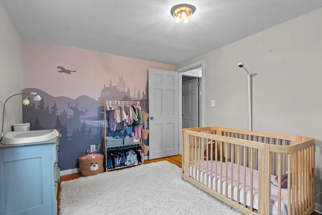 a bedroom with furniture and a window